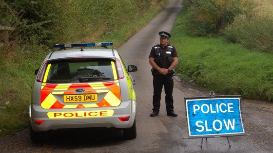 A police officer guards the closed off bridleway in Newton Stacey, near Andover,  where the bodies were found.