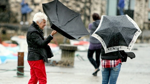People struggle with umbrellas