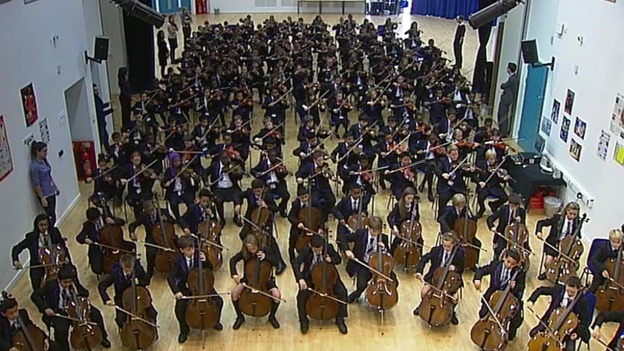 Students rehearse together in the school hall.