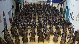 Students rehearse together in the school hall.