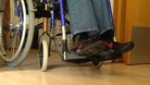 A person in a wheelchair.