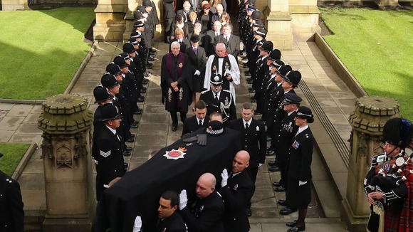 The coffin of PC Fiona Bone is carried from Manchester Cathedral
