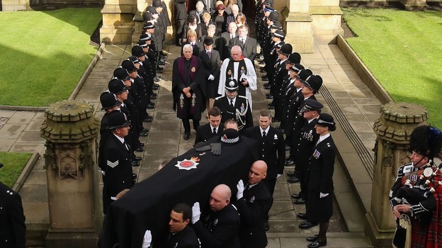 The coffin of PC Fiona Bone is carried from Manchester Cathedral