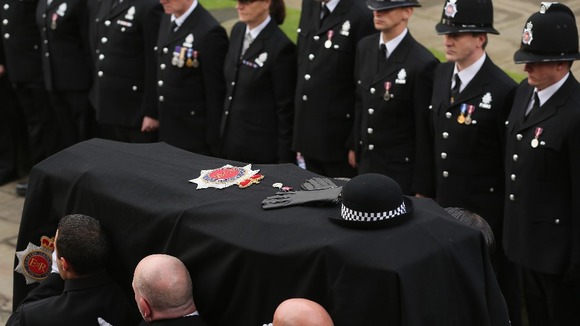 The hat, gloves and Queen's Jubilee medal, lay on top of the coffin of Pc Fiona Bone