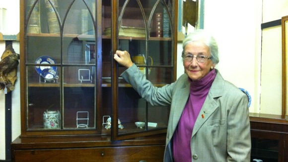 Shelagh Walker with empty cupboards