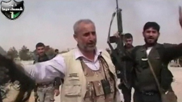 Syrian rebels celebrate 'capturing' an airbase outside Damascus