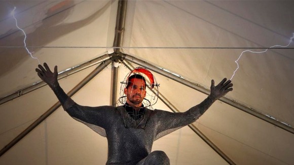 Magician David Blaine performs a demonstration of his upcoming performance "Electrified" during a press briefing in New York.