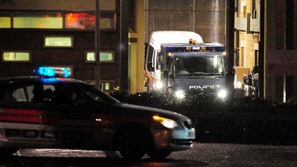 Police vehicles leave HMP Long Martin in Worcestershire