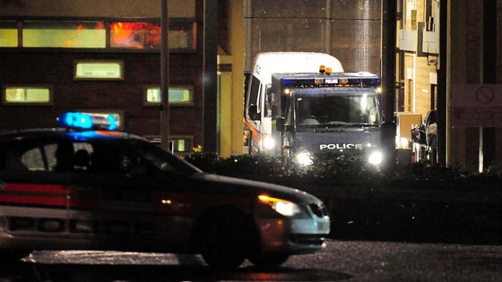 Police vehicles leave HMP Long Martin in Worcestershire