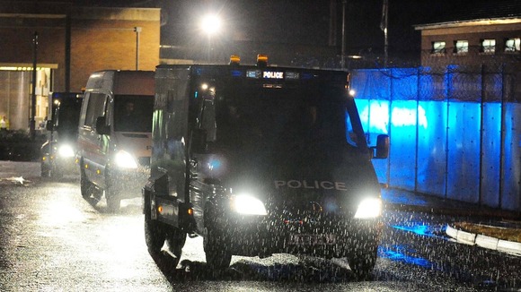Police vehicles leave HMP Long Martin in Worcestershire