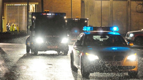 Police vehicles leave HMP Long Martin in Worcestershire