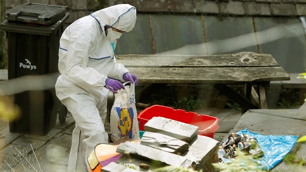 Forensic officers search the home of Mark Bridger