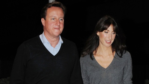 David Cameron with his wife Samantha last night on the eve of the Conservative Party conference.