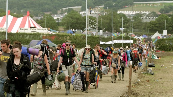 Festival goers leave Worthy Farm and the Glastonbury Festival in Somerset last year