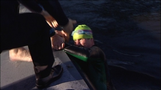 Henry is helped out of the cold water