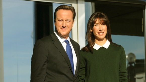 Prime Minister David Cameron and his wife Samantha arrive at the Conservative Party