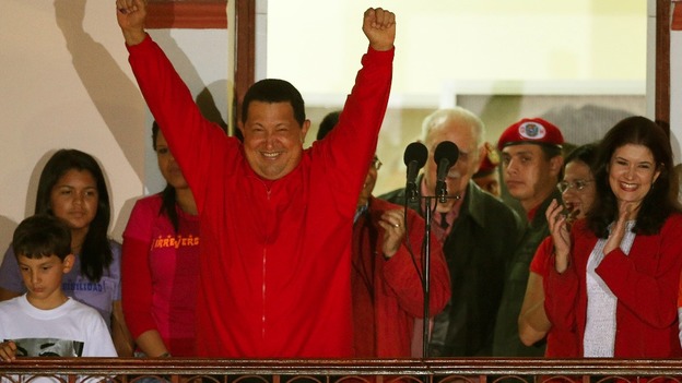 Venezuelan President Hugo Chavez celebrates from people's balcony at Miraflores Palace in Caracas