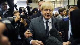 London Mayor Boris Johnson arrives at Birmingham New Street Station before attending the Conservative Party conference.