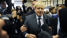 London Mayor Boris Johnson arrives at Birmingham New Street Station before attending the Conservative Party conference.