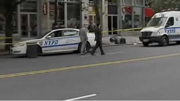 Investigators at the scene of Mike Jones' murder in New York.
