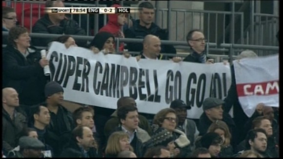 Banners in the crowd for Campbell