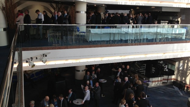 Delegates queue on two floors.
