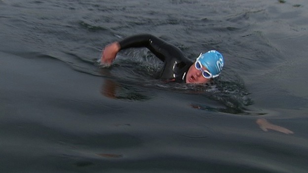 A soldier swimming.