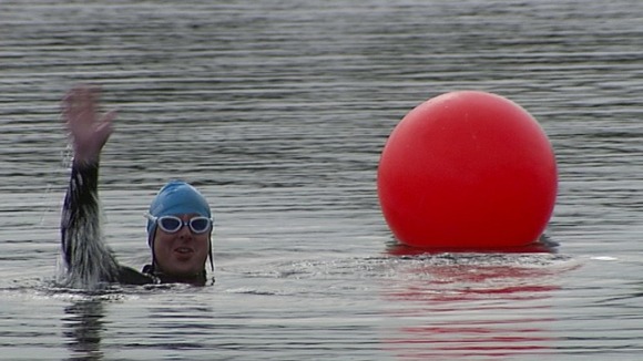 A soldier swimming.