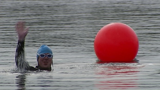 A soldier swimming.