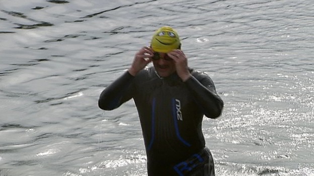 A soldier swimming.