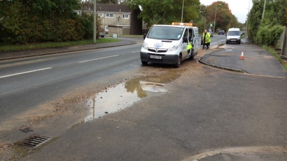 Thames Water engineers work on the burst pipe