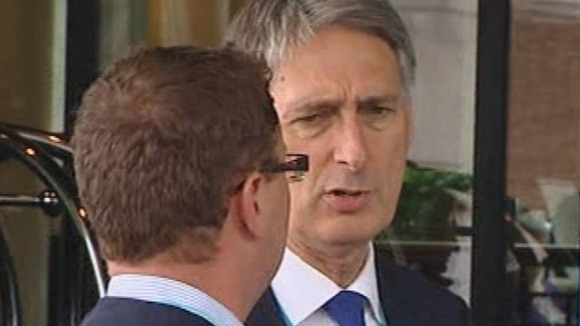 Philip Hammond outside the Conservative Party Conference in Birmingham