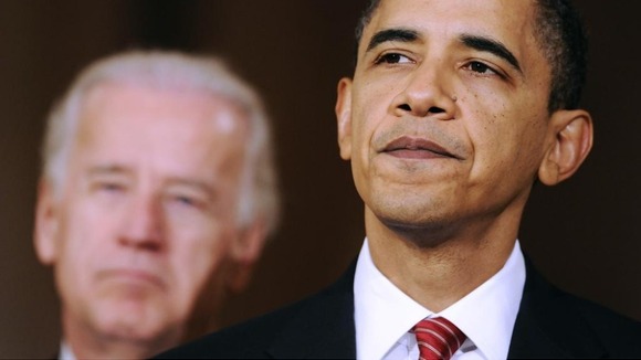U.S. President Barack Obama is flanked by Vice President Joe Biden