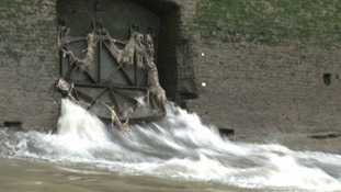Water and raw sewage spills into the River Thames from a combined sewer overflow.