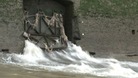 Water and raw sewage spills into the River Thames from a combined sewer overflow.