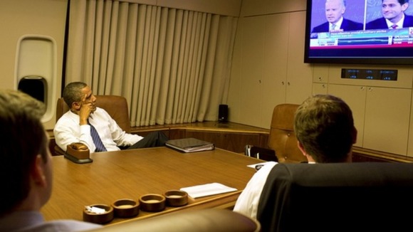 President Obama watches his deputy Joe Biden's debate performance