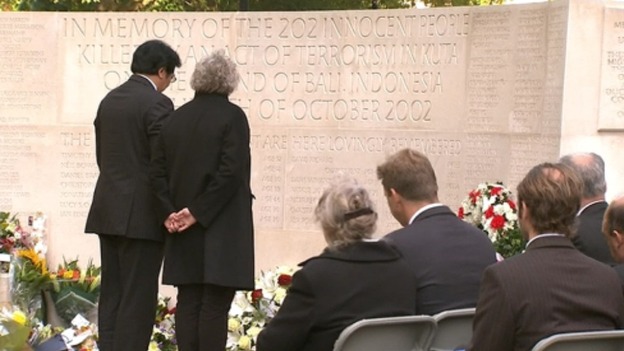 Relatives of victims pay their own respects at the memorial