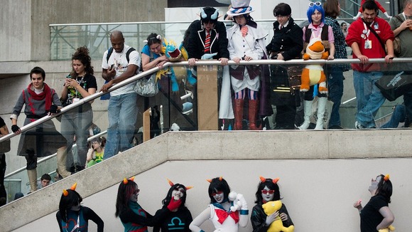Fans take part in a costume contest during the convention.