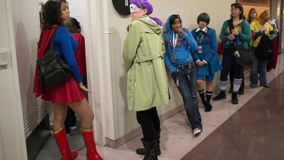 Comic Con-goers queue up to use the restroom during Comic Con at the Jacob Javitz Center in New York.