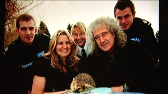 Brian May & hedgehog, wildlife group