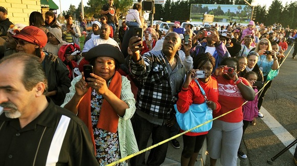 Crowds gather to watch the space shuttle on its journey