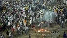  Senegalese football fans light fires at the Leopold Sedar Senghor stadium in Dakar.