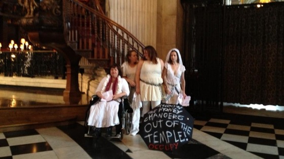 Four women chained themselves to the pulpit.