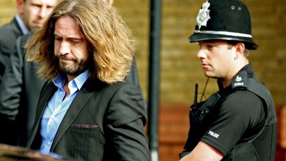Justin Lee Collins leaves St Albans Crown Court after being found guilty of harassing his former partner, Anna Larke.