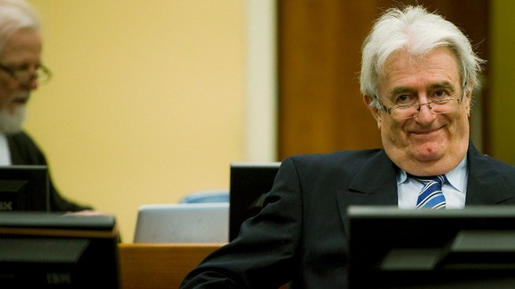 Former Bosnian Serb leader Karadzic sits in the courtroom on the first day of his defence