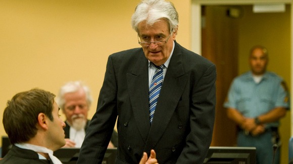 Karadzic talks to member of his legal team in court