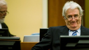 Former Bosnian Serb leader Karadzic sits in the courtroom on the first day of his defence