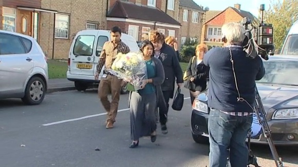 Dr Purnami De Silva arrives to lay flowers on behalf of staff at Princess Alexandra Hospital, Harlow