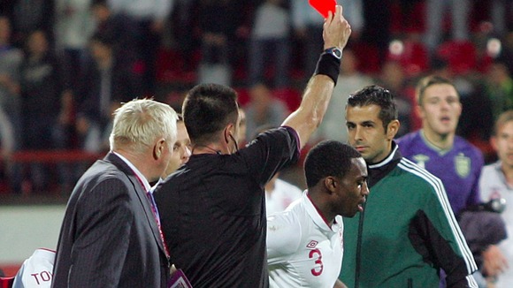 Sunderland's Danny Rose, right, receives a red card from referee Huseyin Gocek during the Under-21 match between Serbia and England.