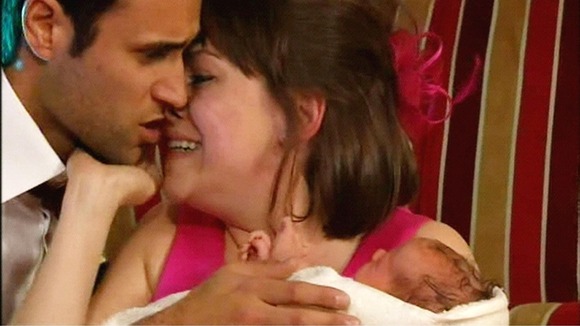 Gennie Walker played by Sian Reese-Williams and Nikhil Sharma played by Rik Makarem with their baby